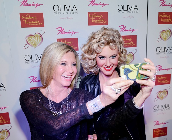 Olivia Newton-John takes a selfie with her wax likeness